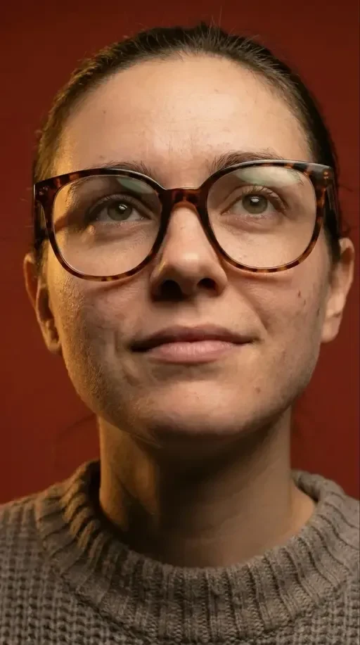 hyper-realistic portrait in tortoiseshell glasses