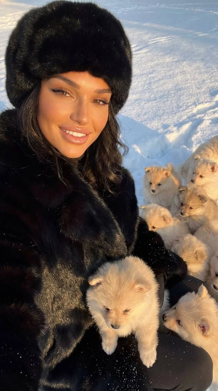 winter selfie with pomeranian puppies