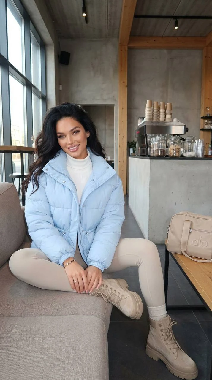Stylish Woman in Puffer Jacket at Cafe
