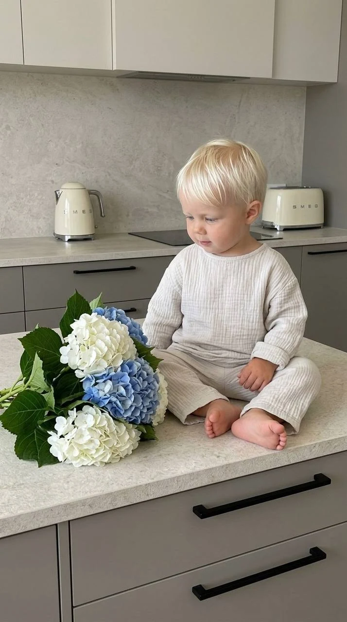 Toddler with Hydrangeas in Modern Kitchen